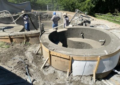 crosby pools workers set the concrete for a new pool