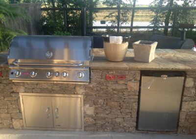 outdoor kitchen area with custom stone work